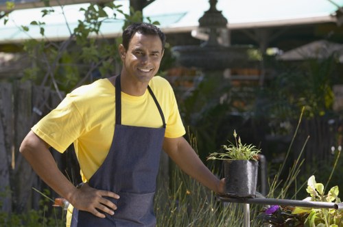 Professional cleaner at work on a patio