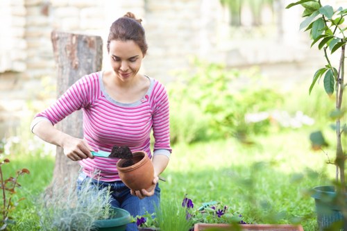 Technician cleaning patio with specialized equipment