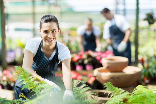 Skilled technician cleaning patio surfaces with care